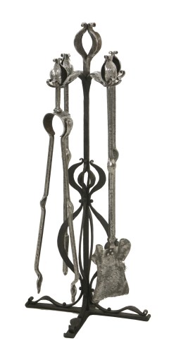 Lot 85 - A set of Arts and Crafts steel fire irons