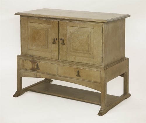 Lot 89 - A Cotswold School oak low cupboard