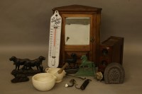 Lot 1424 - A small oak corner cabinet
