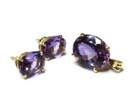 Lot 1005 - An 18ct gold single stone mixed cut amethyst pendant