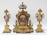 Lot 1505 - A late 19th century French gilt metal and porcelain mantel clock