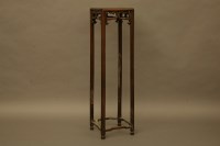 Lot 2068 - A Chinese hardwood jardiniere stand
