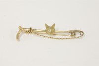Lot 25 - A gold riding crop stick pin