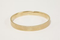 Lot 46 - A 9ct gold slave bangle
