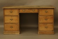 Lot 474 - A pine pedestal desk