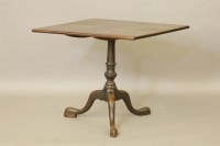Lot 621 - A 19th century mahogany tripod table