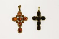 Lot 2 - A 9ct gold oval cut garnet cross
