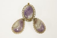 Lot 7 - A gold amethyst oval cabochon pendant brooch