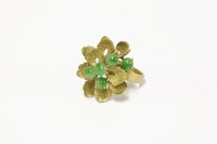 Lot 30 - A gold jade cabochon floral spray ring