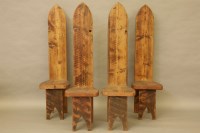 Lot 582 - A set of four pine high back chairs