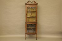 Lot 563 - An Edwardian inlaid mahogany two part display cabinet