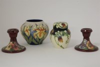 Lot 1186 - A pair of Moorcroft dwarf candlesticks