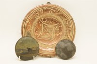 Lot 135 - A 17th - 18th century Hispanic ruby lustre dish with stylised geometric decoration