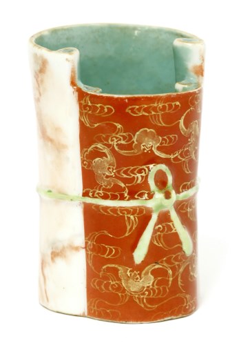 Lot 1111 - A Chinese faux-marble enamelled porcelain brush pot