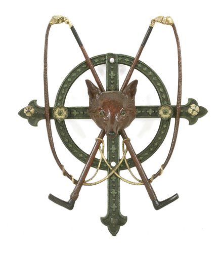 Lot 19 - A cast iron wall hanging whip stand