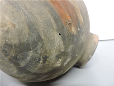 Lot 13 - A Chinese earthenware cocoon jar