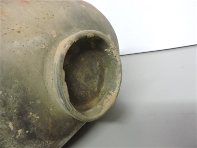 Lot 13 - A Chinese earthenware cocoon jar