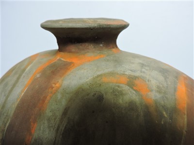Lot 13 - A Chinese earthenware cocoon jar