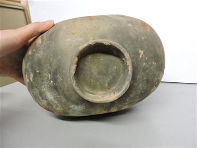 Lot 13 - A Chinese earthenware cocoon jar