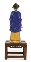 Lot 90 - A Chinese painted clay nodding-head figure