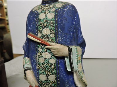 Lot 90 - A Chinese painted clay nodding-head figure