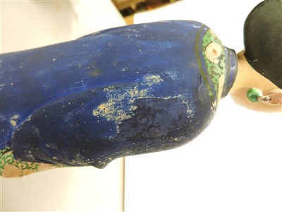 Lot 90 - A Chinese painted clay nodding-head figure