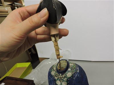 Lot 90 - A Chinese painted clay nodding-head figure