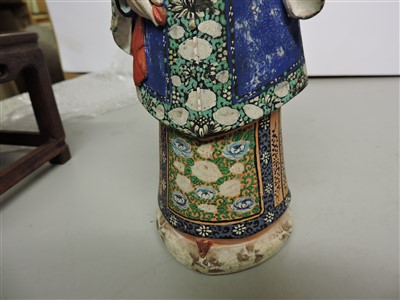 Lot 90 - A Chinese painted clay nodding-head figure