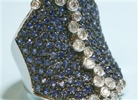 Lot 290 - A Continental white gold diamond and sapphire saddle ring