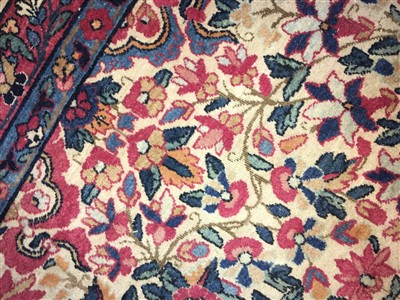 Lot 36 - A Kirman carpet