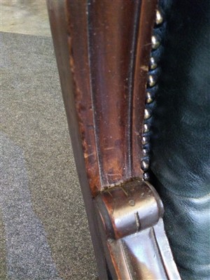 Lot 31 - A William IV mahogany and green buttoned leather library chair