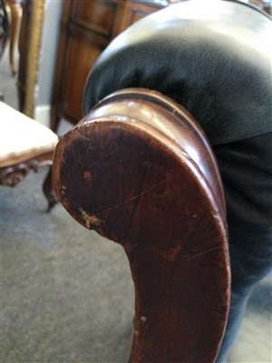 Lot 31 - A William IV mahogany and green buttoned leather library chair