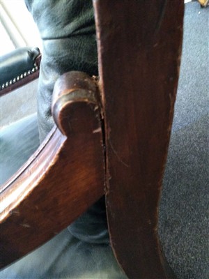 Lot 31 - A William IV mahogany and green buttoned leather library chair