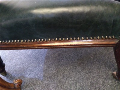 Lot 31 - A William IV mahogany and green buttoned leather library chair