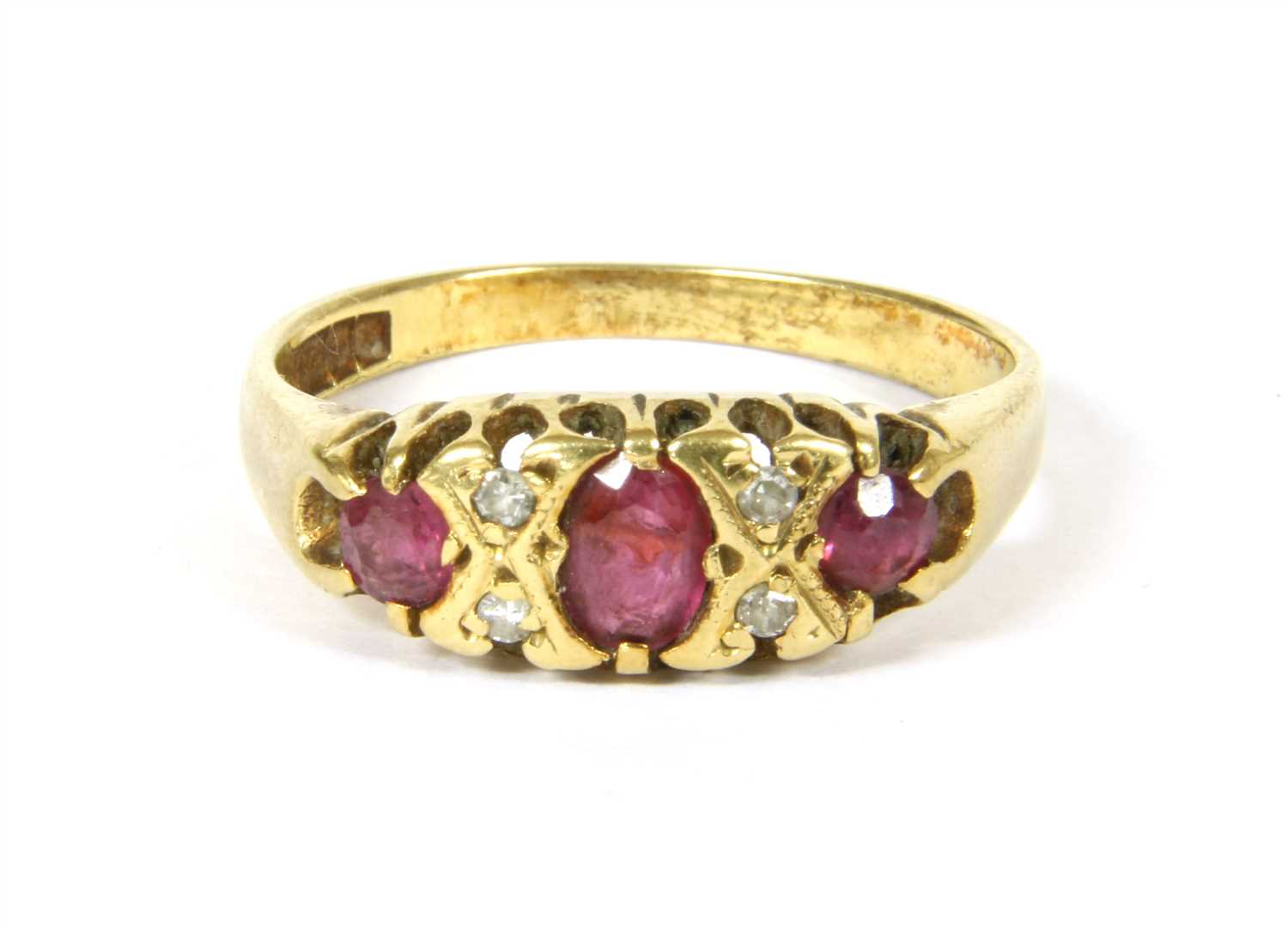 Lot 47 - A three stone ruby ring