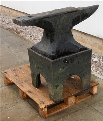 Lot 606 - A large cast iron anvil on separate stand