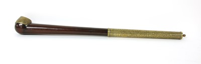Lot 67 - A Chinese wood and brass-mounted opium pipe