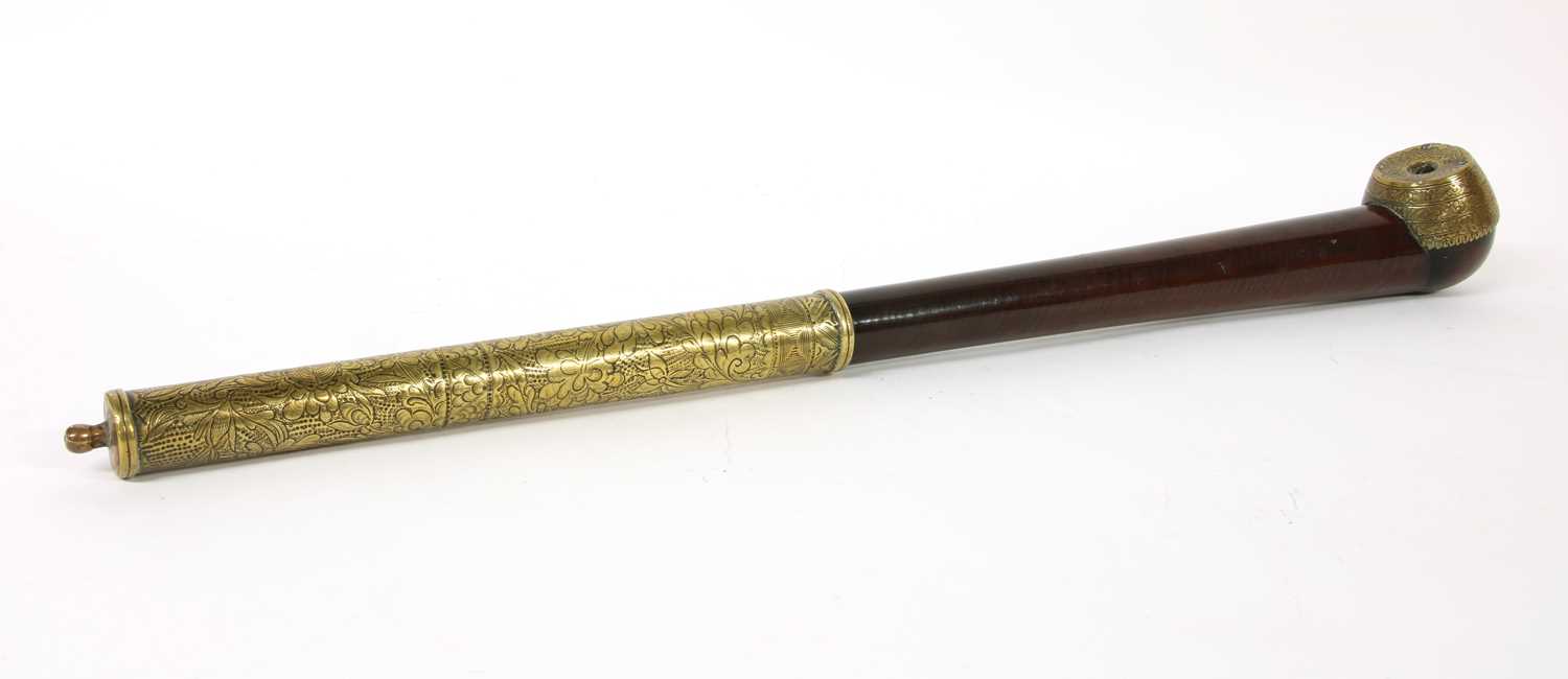 Lot 67 - A Chinese wood and brass-mounted opium pipe
