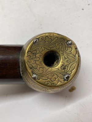 Lot 67 - A Chinese wood and brass-mounted opium pipe