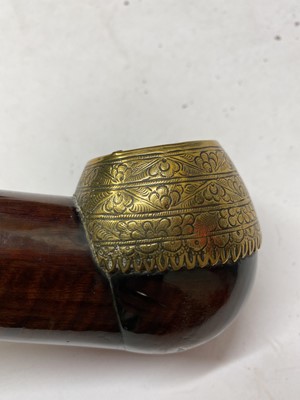 Lot 67 - A Chinese wood and brass-mounted opium pipe