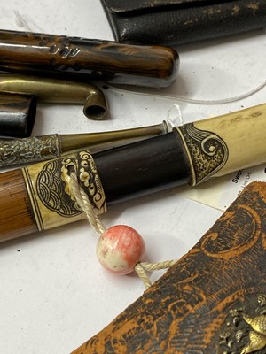 Lot 25 - Three Japanese smoking sets, kiseruzutsu (pipecase) with kiseru and tabako-ire (tobacco pouch)