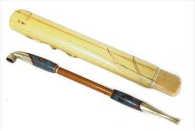 Lot 36 - A Japanese ivory kiseruzutsu with kiseru