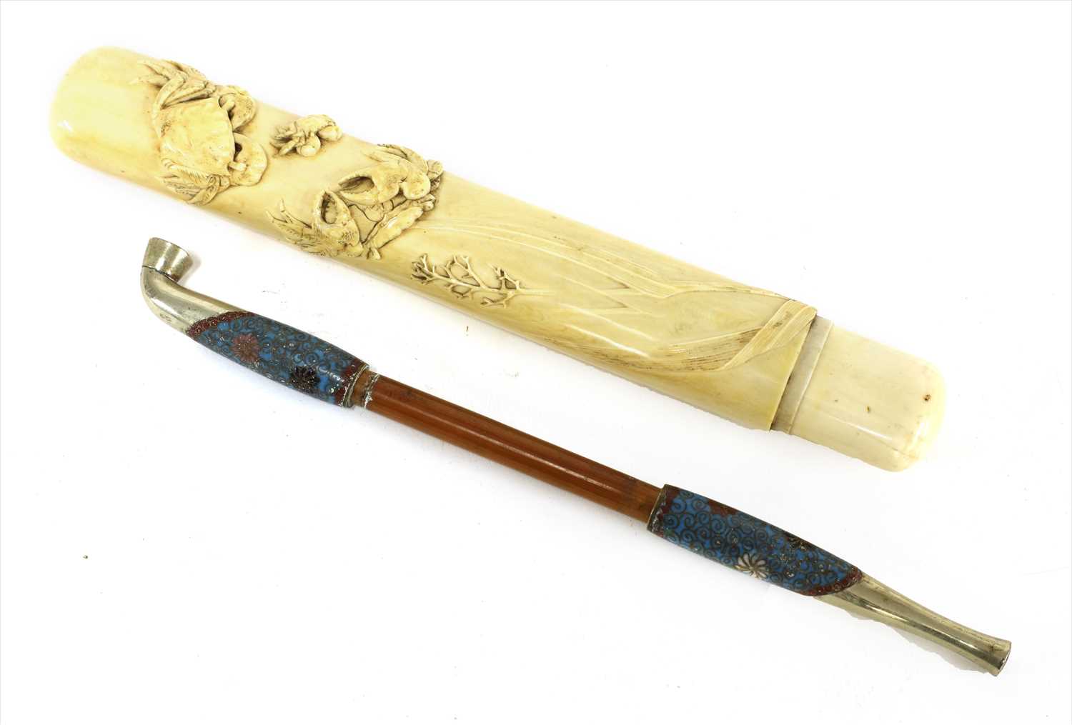 Lot 36 - A Japanese ivory kiseruzutsu with kiseru