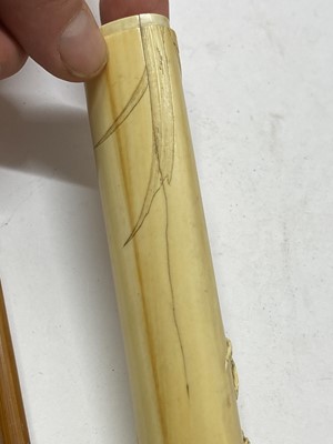 Lot 36 - A Japanese ivory kiseruzutsu with kiseru