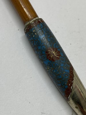 Lot 36 - A Japanese ivory kiseruzutsu with kiseru