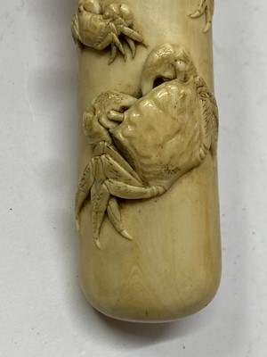 Lot 36 - A Japanese ivory kiseruzutsu with kiseru