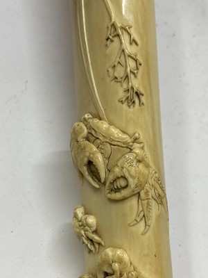 Lot 36 - A Japanese ivory kiseruzutsu with kiseru