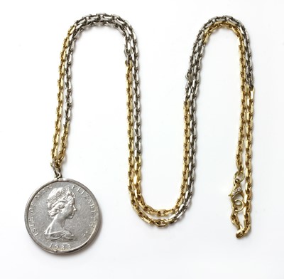 Lot 242 - A platinum and 18ct gold coin pendant with an Isle of Man one noble platinum coin