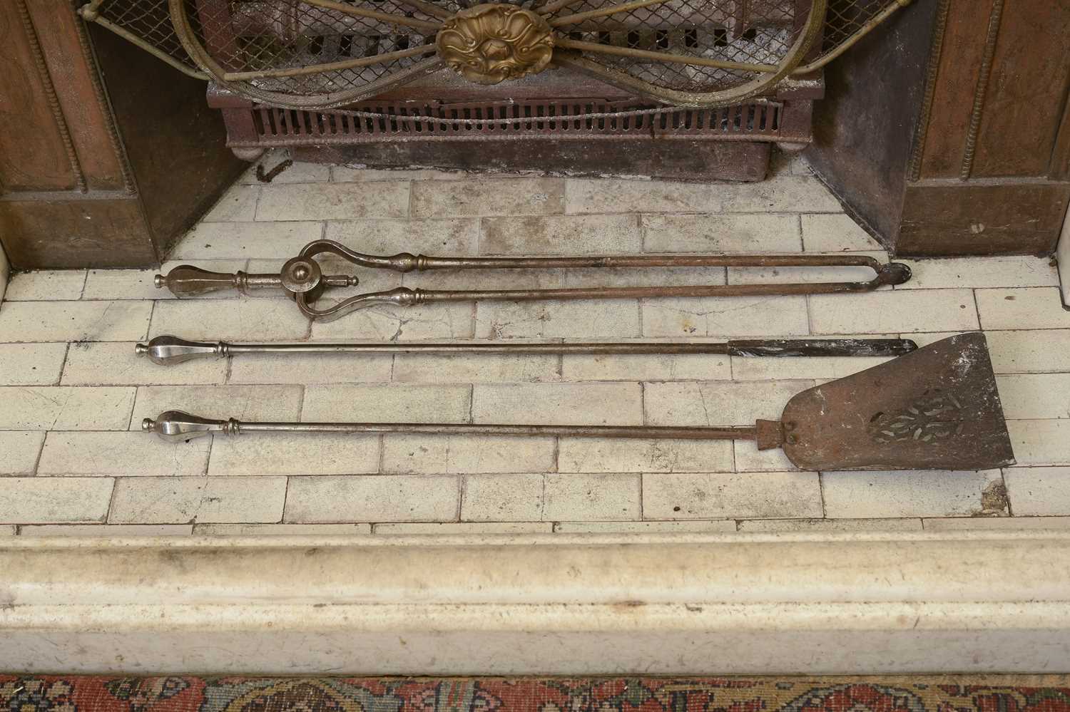 Lot 119 - A set of three George III steel fire irons