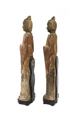 Lot 15 - A pair of Chinese pottery figures